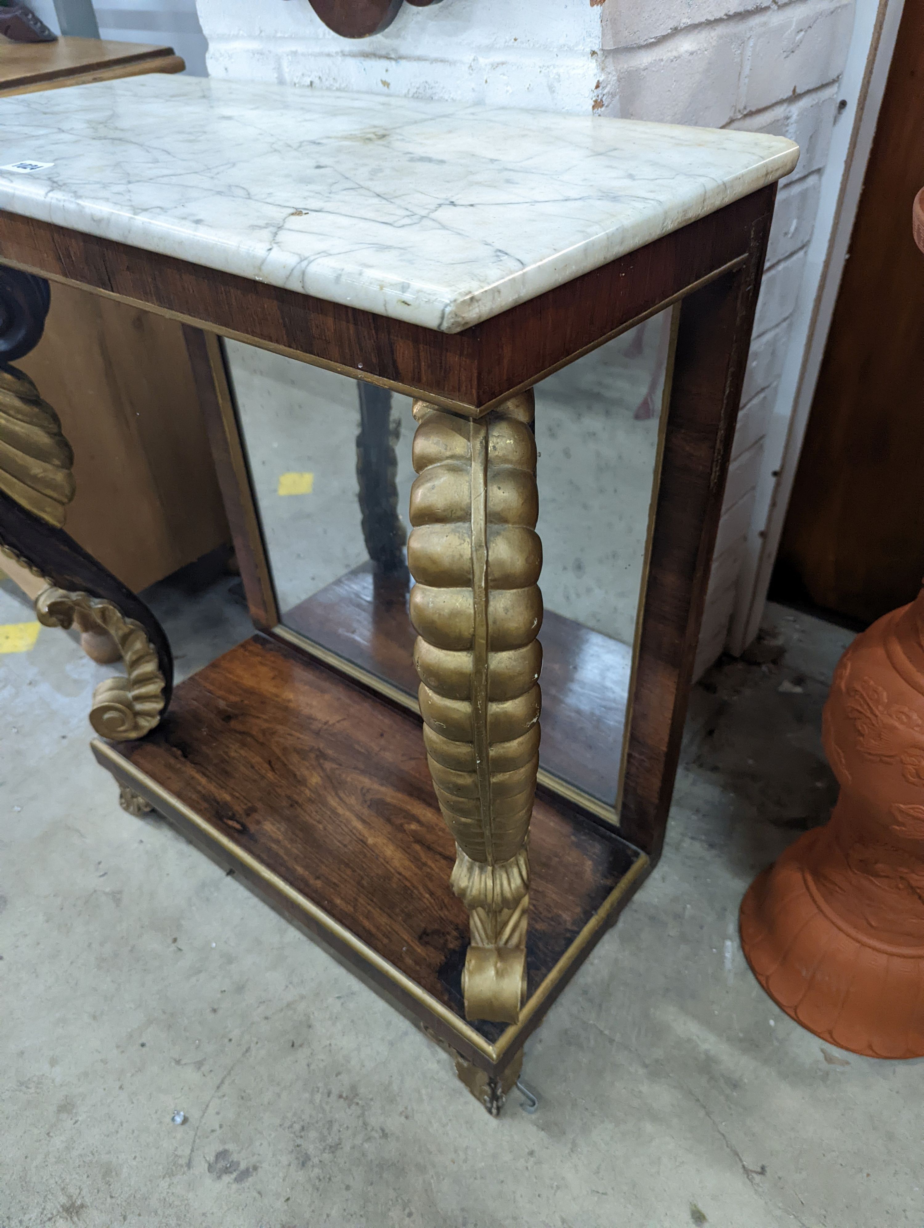 A Regency rosewood and parcel gilt marble topped console table, width 74cm, depth 36cm, height 82cm